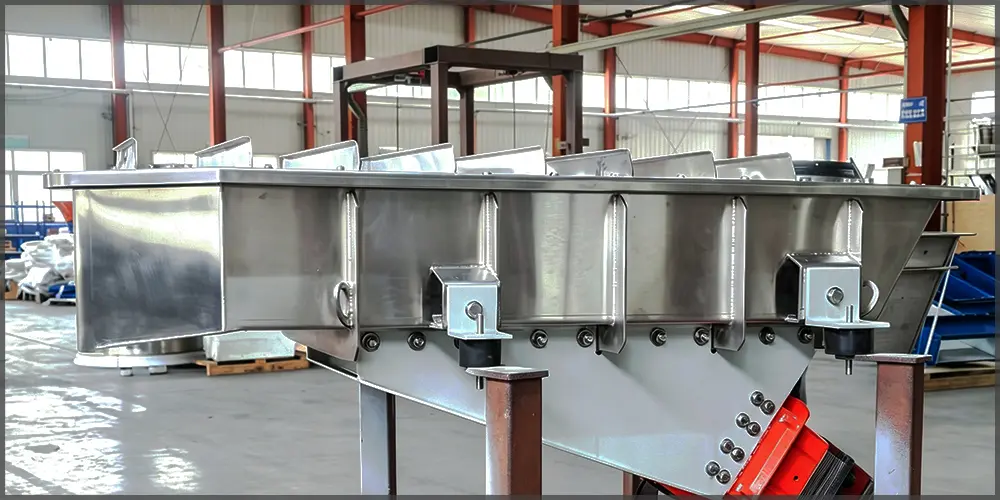 Large food grade stainless steel electromagnetic vibratory feeder finished product in manufacturing workshop